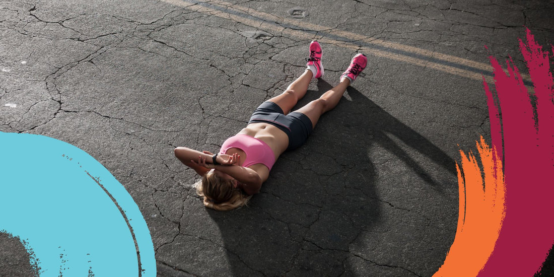 Exhausted runner lying on road - Levelle Nutrition