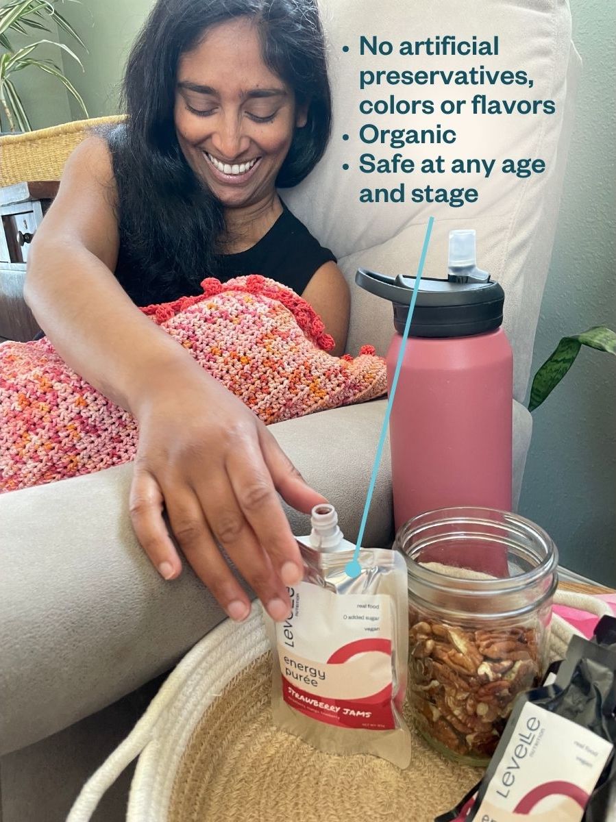 image of mom with baby reaching for an energy puree
