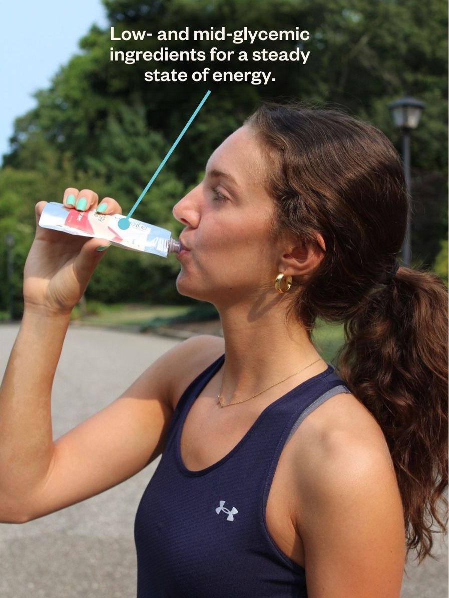 image of female athlete eating an energy puree