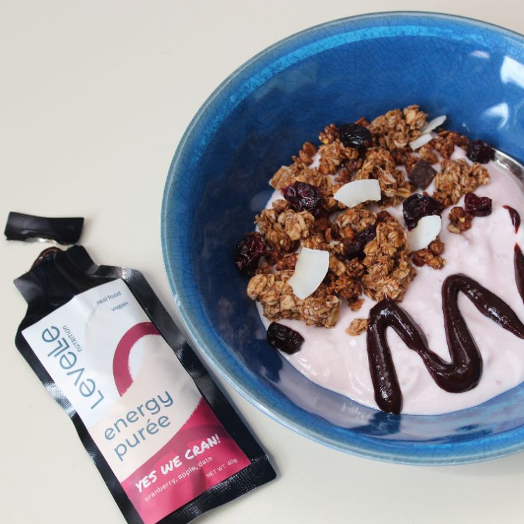 image of puree drizzled on bowl of gronola and yogurt